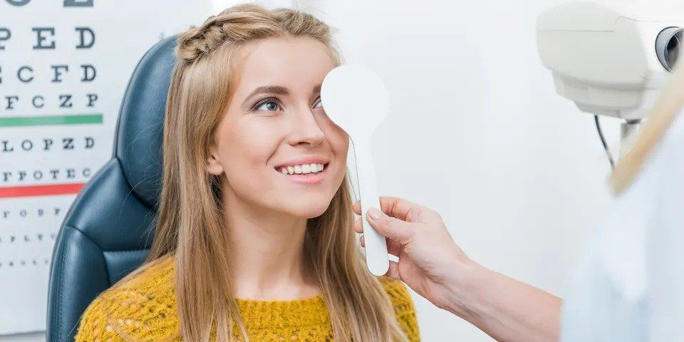 A girl taking an eye examination — New London, WI — Griebenow Eyecare Sc Clintonville