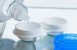 Putting a liquid in contact lenses case — New London, WI — Griebenow Eyecare Man wearing contact lenses — New London, WI — Griebenow Eyecare Sc Clintonville Putting a liquid in contact lenses case — New London, WI — Griebenow Eyecare Man wearing contact lenses — New London, WI — Griebenow Eyecare Sc Clintonville