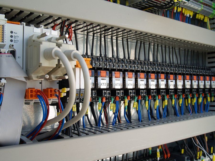 A bunch of wires are connected to an electrical panel