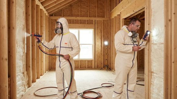 Professional Temple Spray Foam Pros technicians installing residential insulation