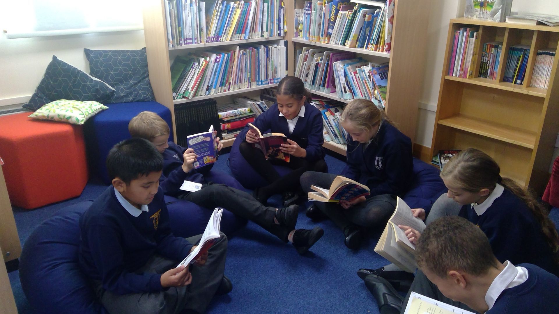 Pupils at St Mary's reading books in the library