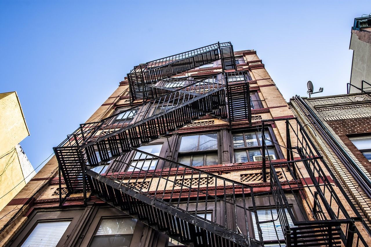 Apartment building with fire escape, representing tenant rights and eviction legal guidance in Florida.