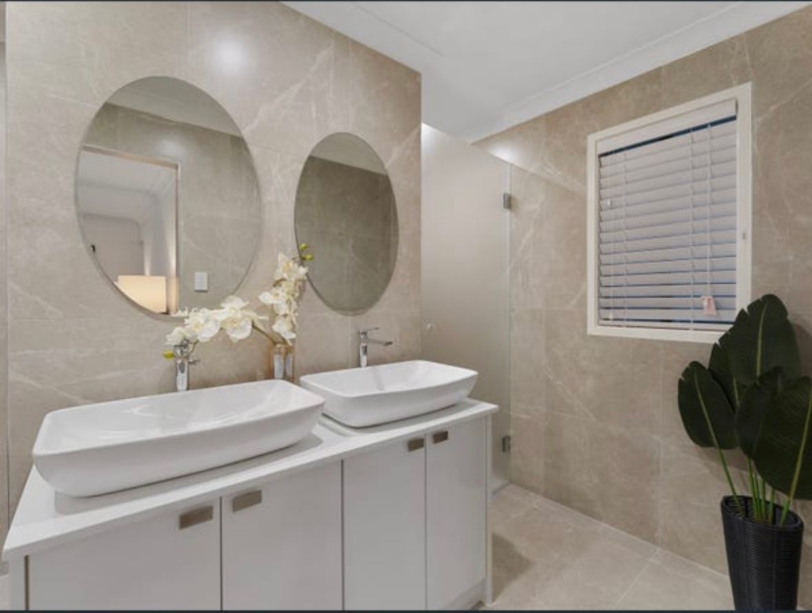 Two Sinks And Two Mirrors Are In A Bathroom — Otto’s Plumbing & Gasfitting in Aspley, QLD