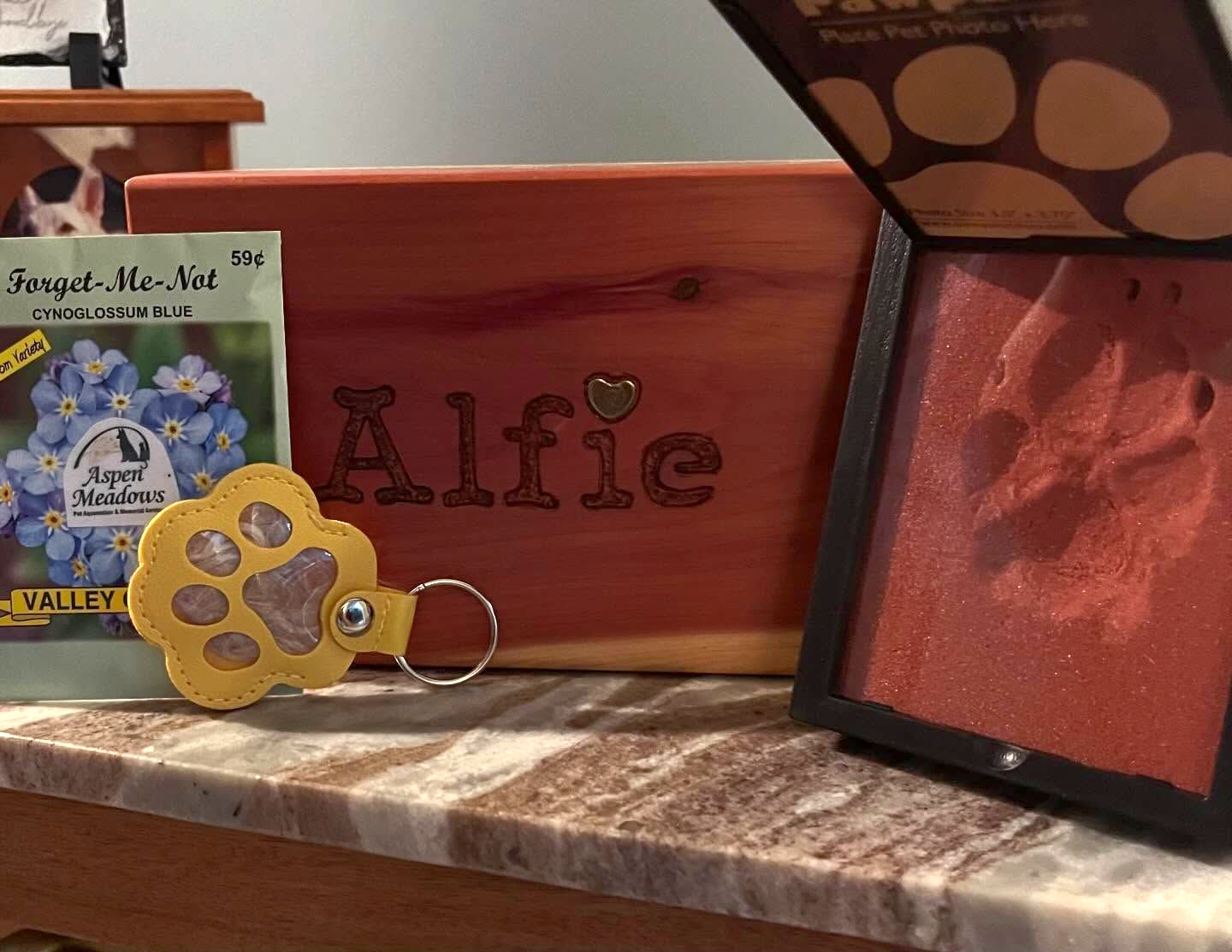 a personalized wooden box memorial urn engraved with a pet's name