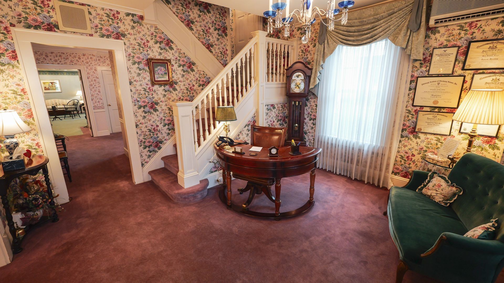 interior of jennings calvey funeral home main entrance area with staircase
