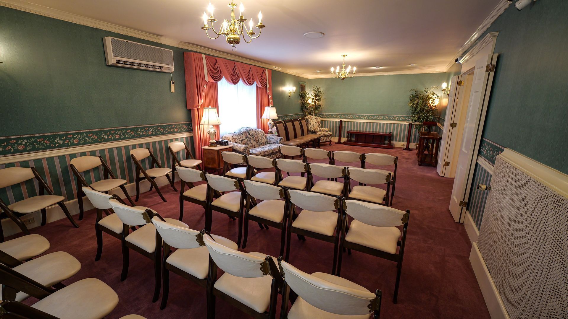 interior of jennings calvey funeral home viewing area with rows of chairs