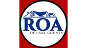ROA of Lane County logo: white circle with blue house outline, blue 