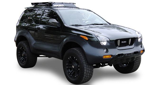 Dark green off-road SUV with roof rack and black wheels on white background