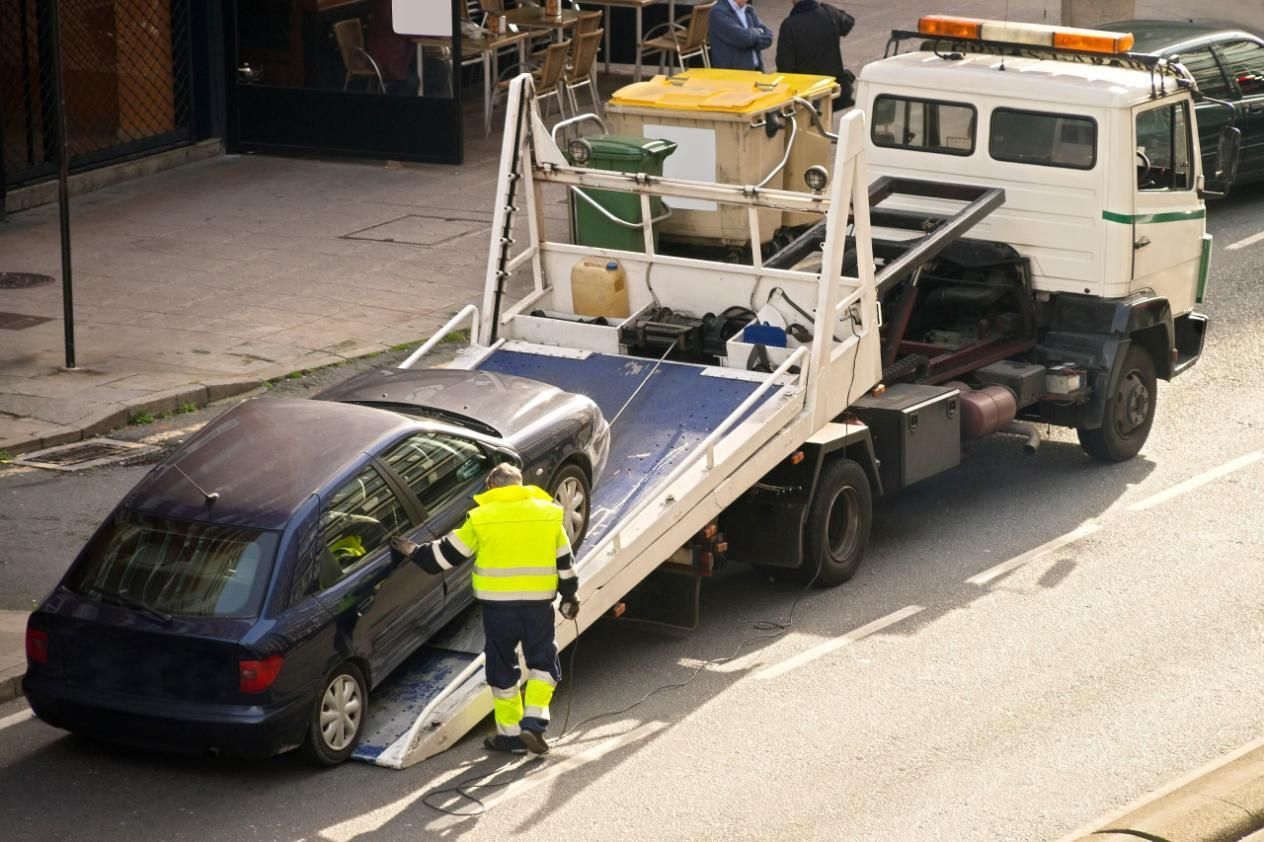 A Tow Truck is Towing a Car on the Side of the Road — Bulahdelah Towing In Karuah, NSW