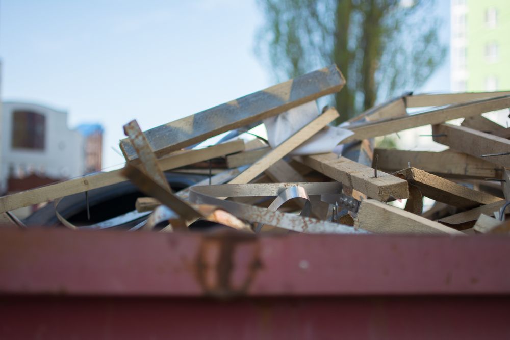 Pile of Wooden Planks in a Rusty — Tamworth Skips and Rubbish Removal in South Tamworth, NSW