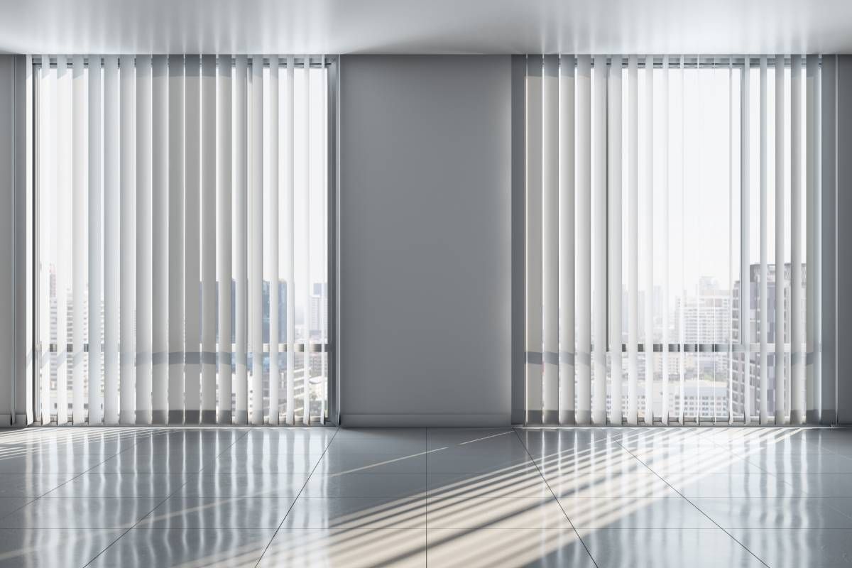 Vertical blinds for two large windows with a view of a city skyline at My Blind Spot near Virginia Beach, VA