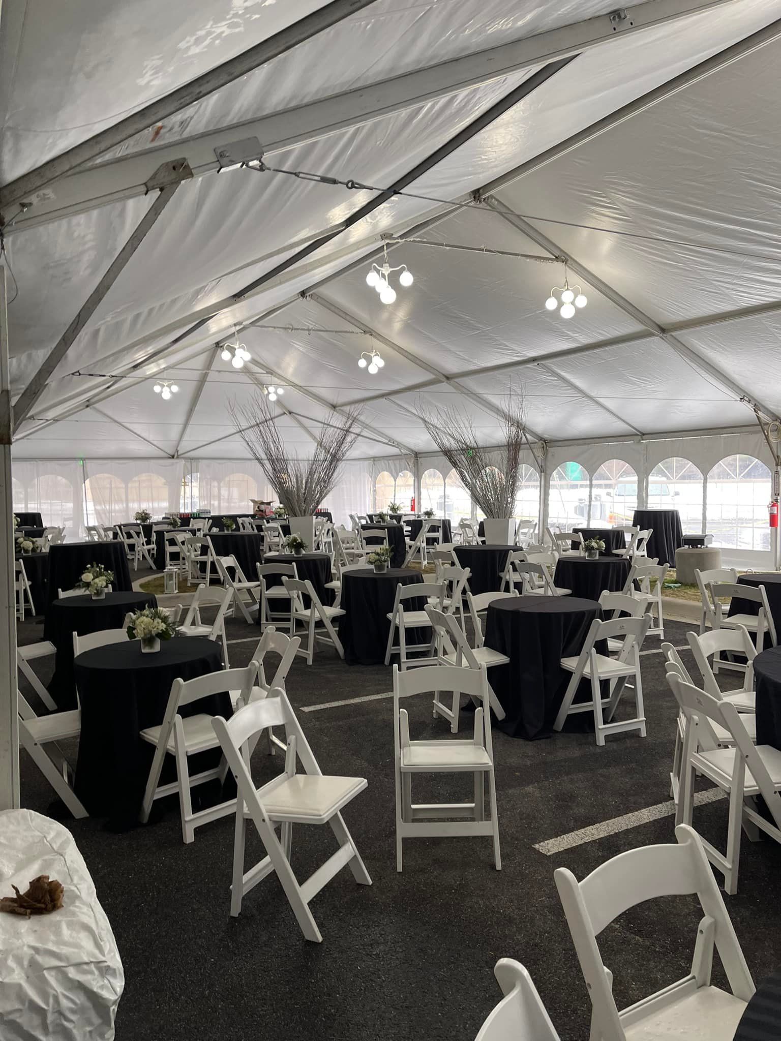A Large Tent Filled With Tables and Chairs for a Wedding Reception