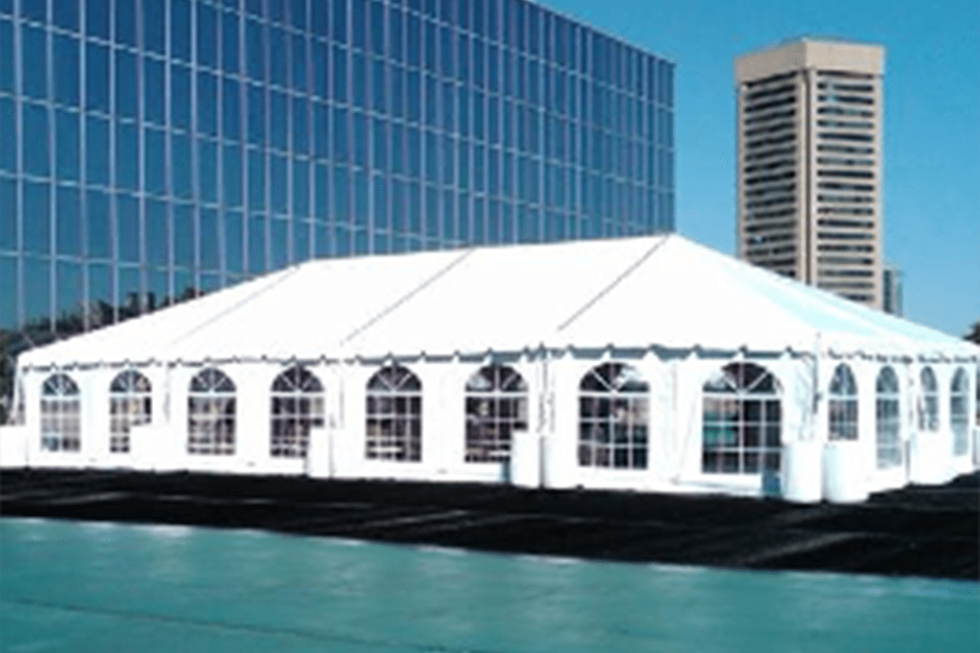 A Large White Tent is Sitting in Front of a Building