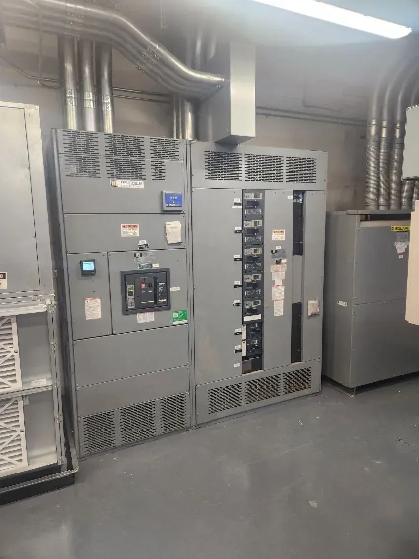 A room with a lot of electrical equipment in it.