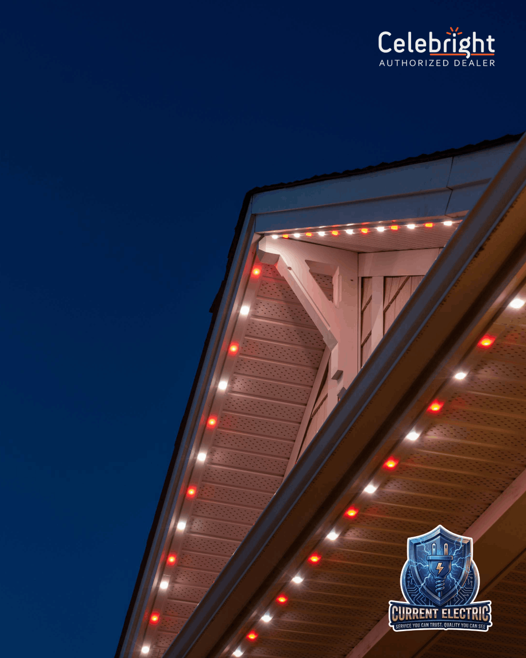 Person installing black string lights on a brick wall above a window