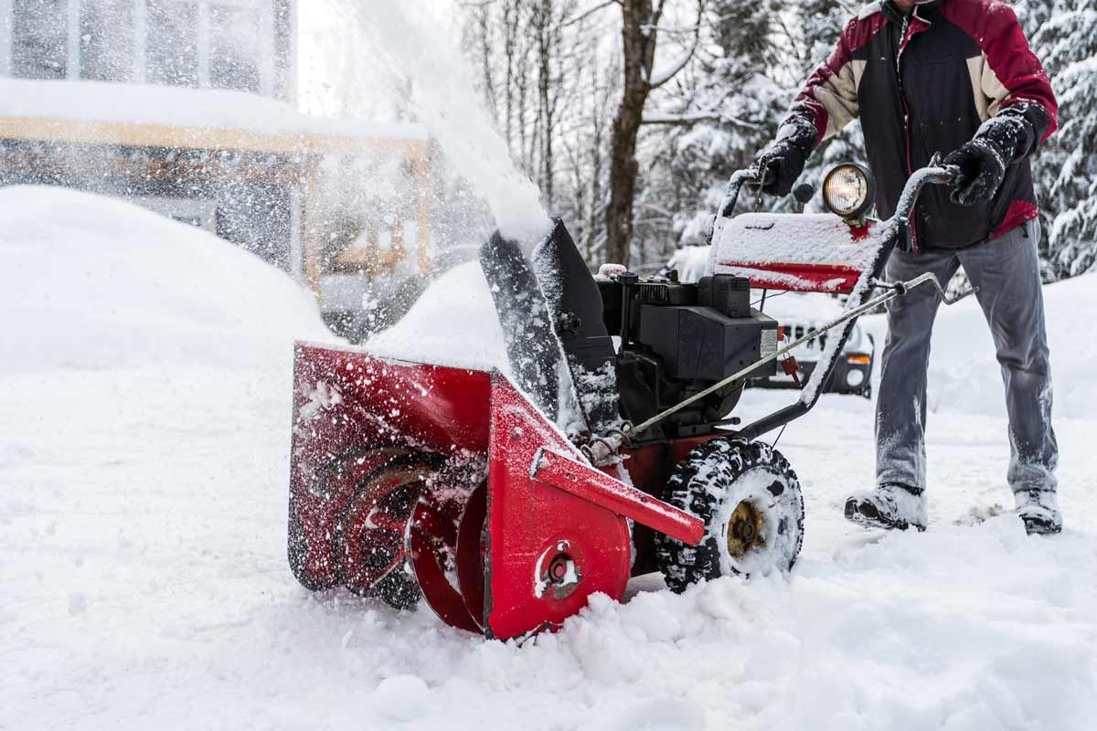 Man using snow blower — Kalamazoo, MI — Precision Tree Care