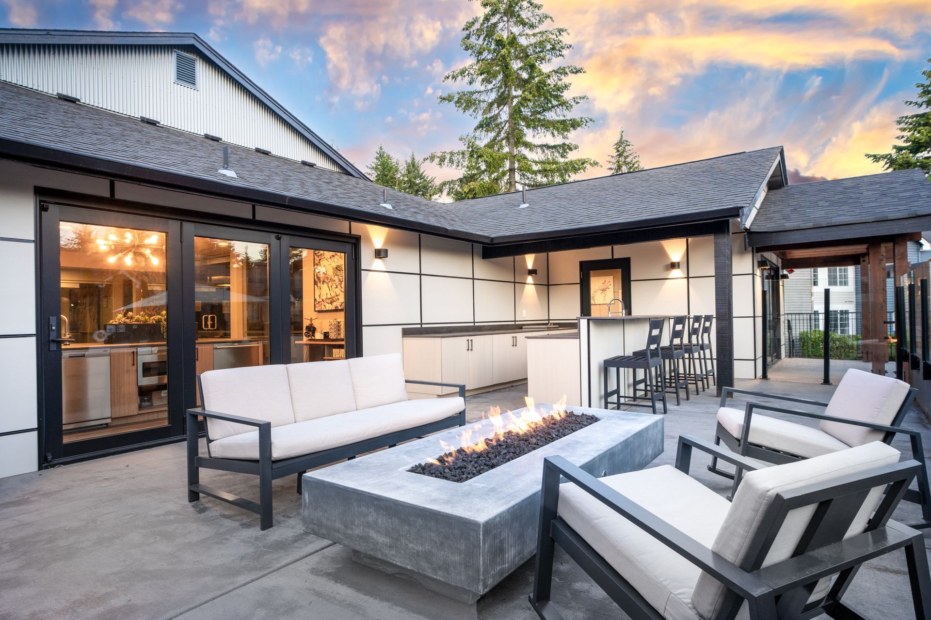 There is a fire pit in the middle of the patio.