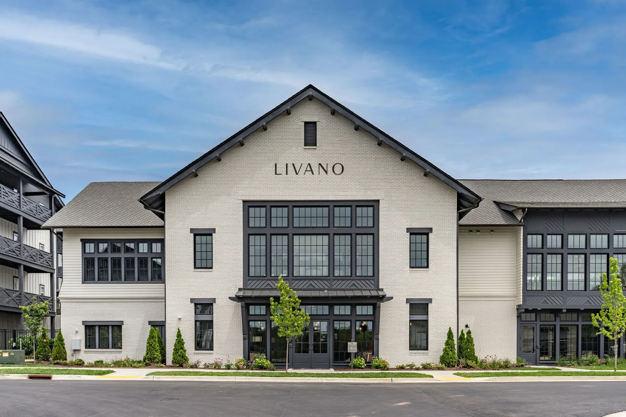 Two young boys are playing a game of connect four in a living room.