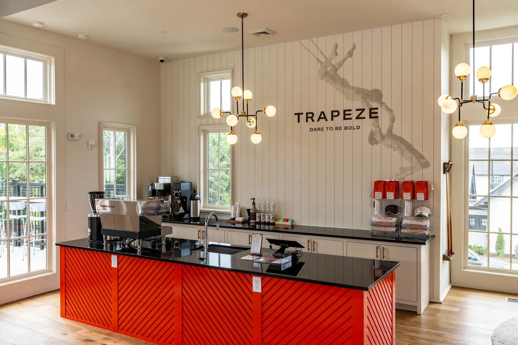 A kitchen with red cabinets and a sign that says trapeze at Livano Trinity in Nashville, TN.
