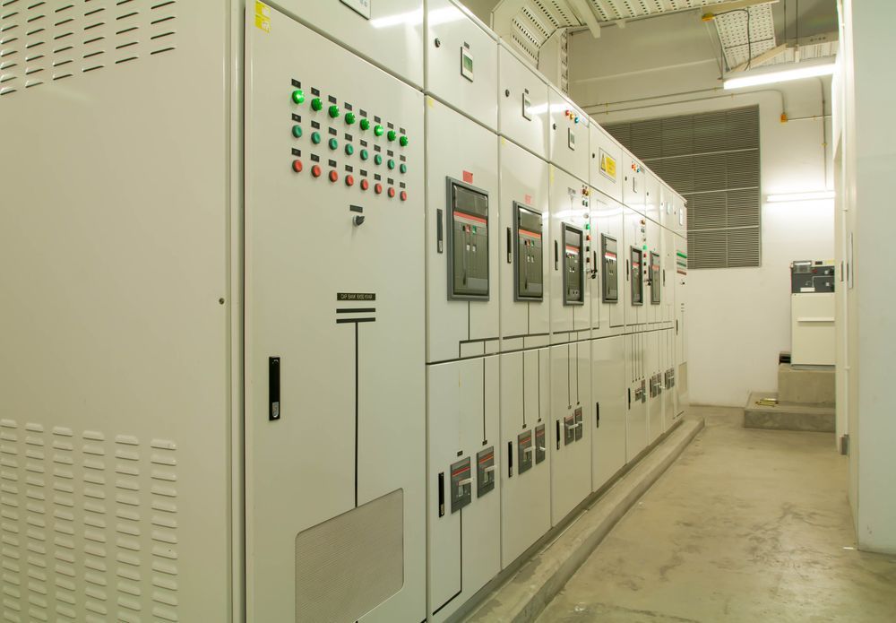 Electrical Control Panels in a White-walled Room With a Concrete Floor  — FAW Electrical in Callala Beach, NSW