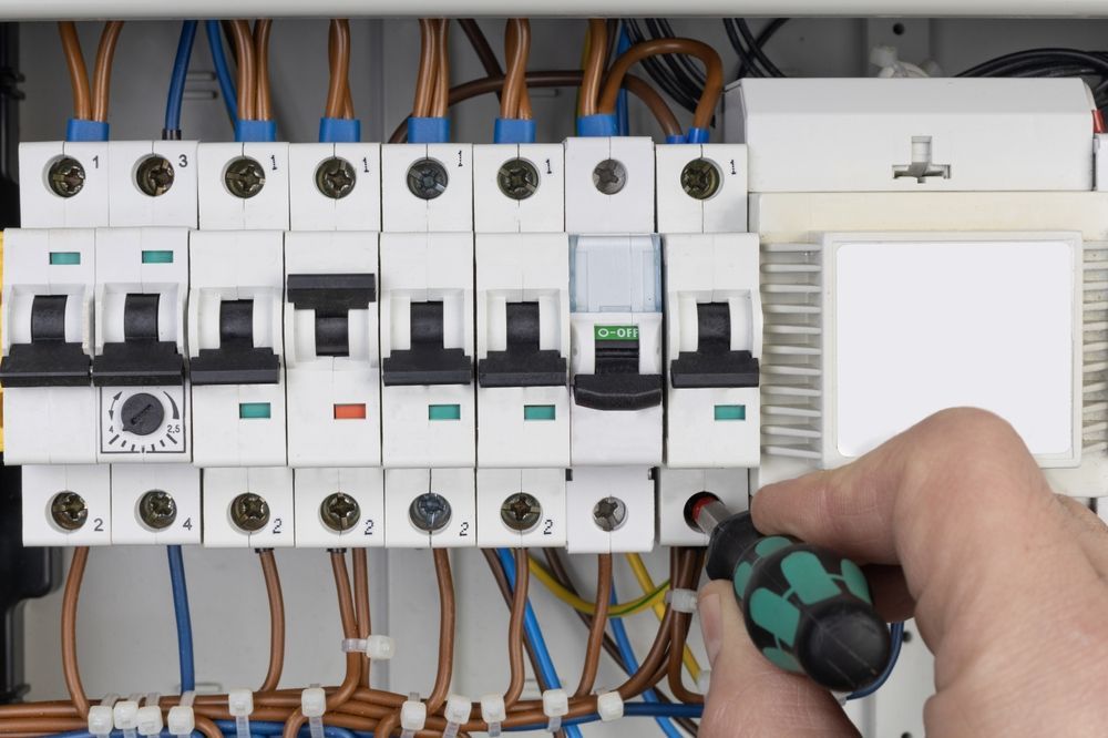 Electrician Fixing Electrical Switchboard