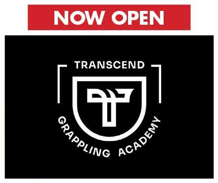 Transcend Grappling Academy logo in white on black, with a shield and stylized grappling emblem