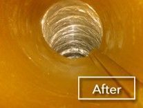 A close up of a hole in a pipe with a sign that says `` after ''.