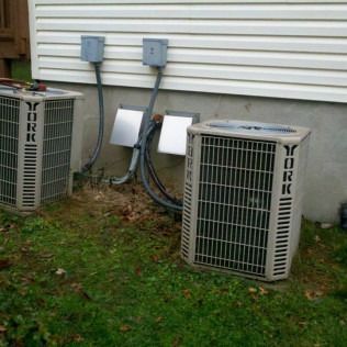 Two York air conditioning units outside a building.