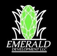 Logo for Emerald Development LLC with a green emerald and white grass-like outline on a black background