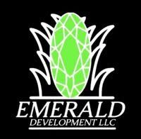 Logo for Emerald Development LLC with a green emerald and white grass-like outline on a black background