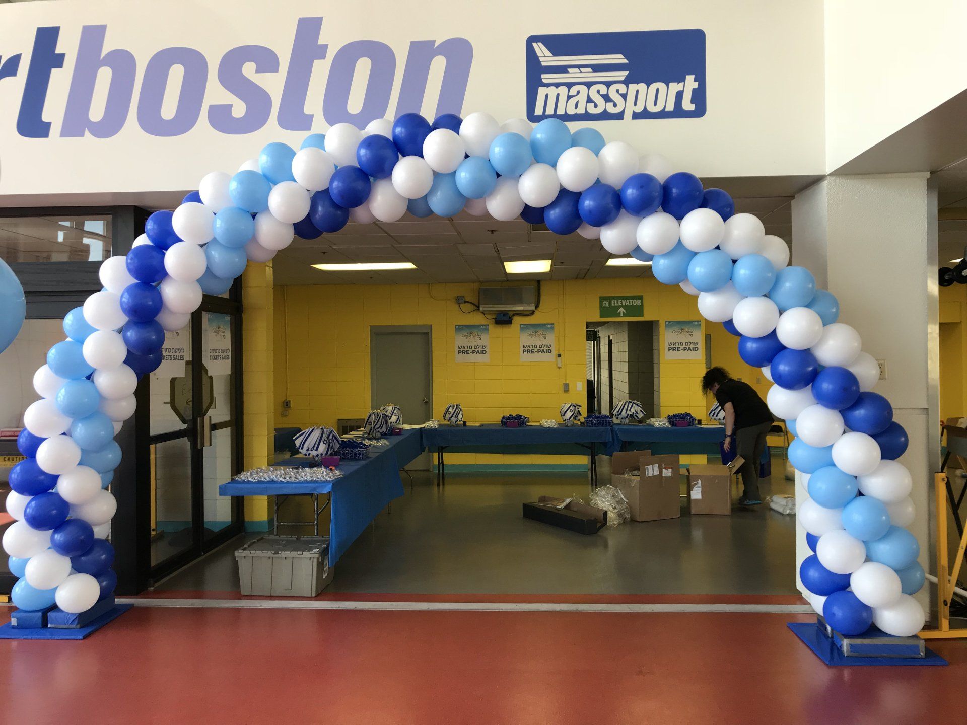 Blue, white, and light blue 35' Boston balloon arch at the Boston Seaport.