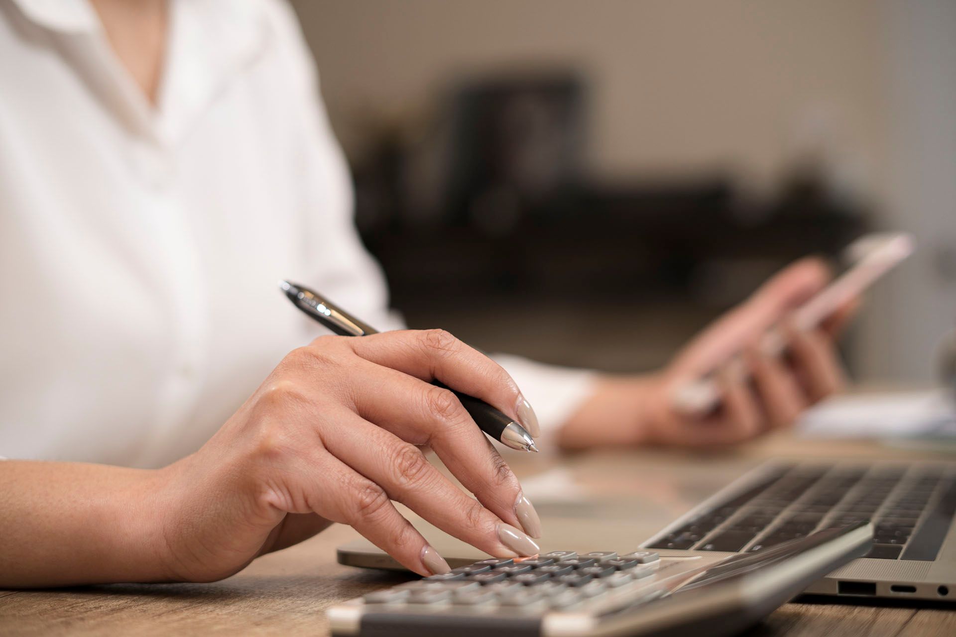 Woman Making Calculations — Springdale, AR — LFG: Special Needs Division Woman Making Calculations — Springdale, AR — LFG: Special Needs Division