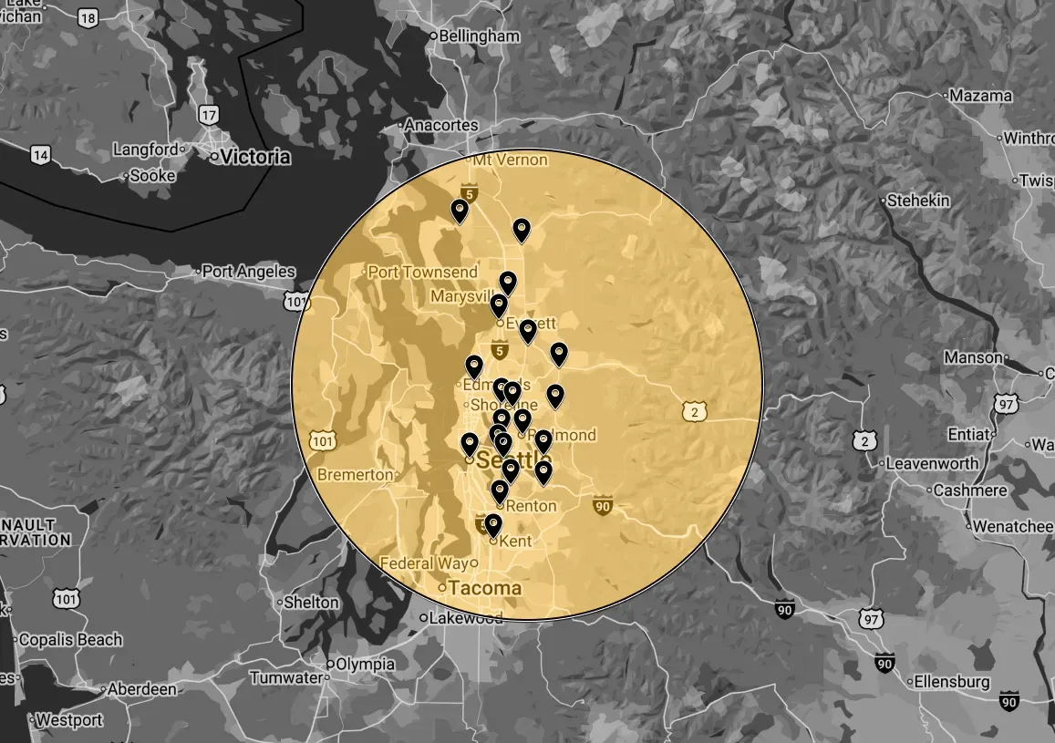 A grayscale map of the Seattle area overlaid with a gold circular zone featuring multiple plotted location markers.
