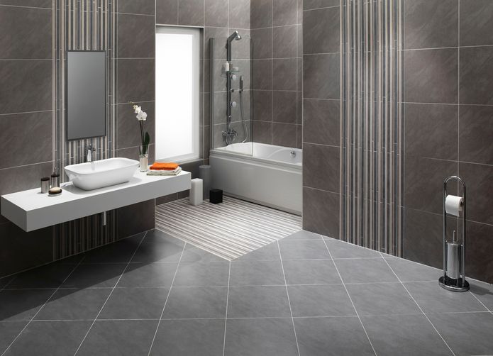 A bathroom with a sink , mirror , tub and shower.