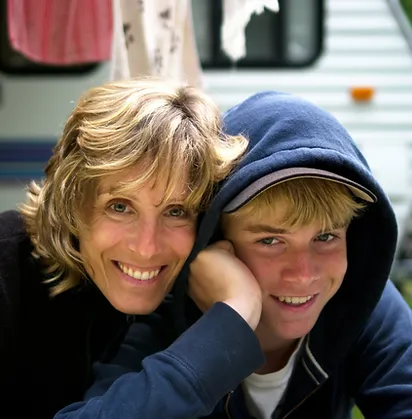 Mother and son both smiling