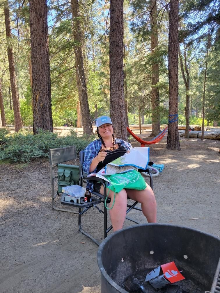 Roya Dedeaux camping and cross stitching