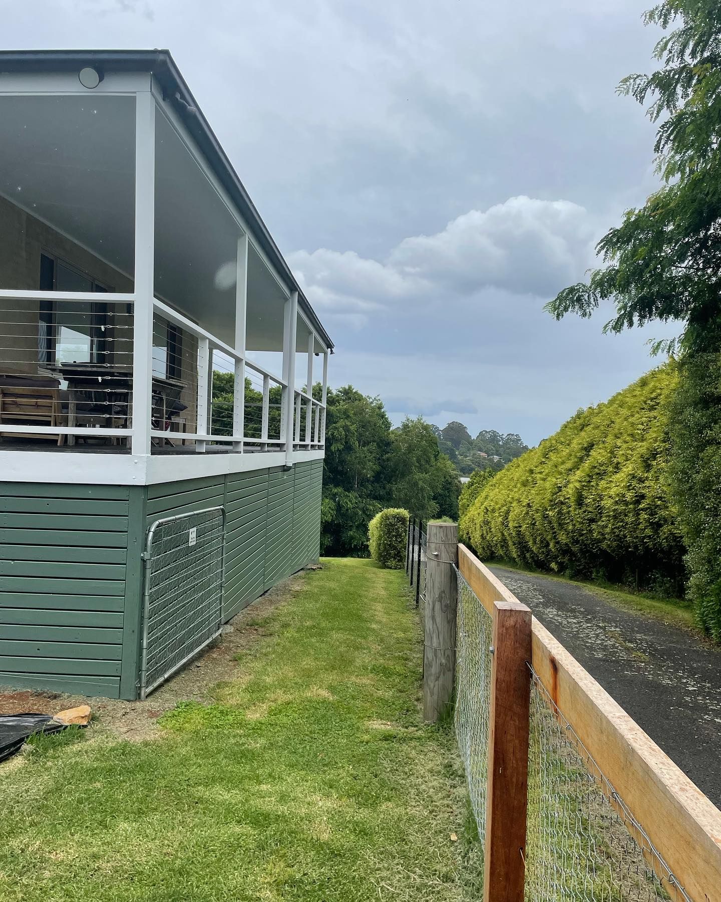 A House With a Porch and a Fence in Front of It — Karl Witt Painter & Decorator In Albion Park, NSW