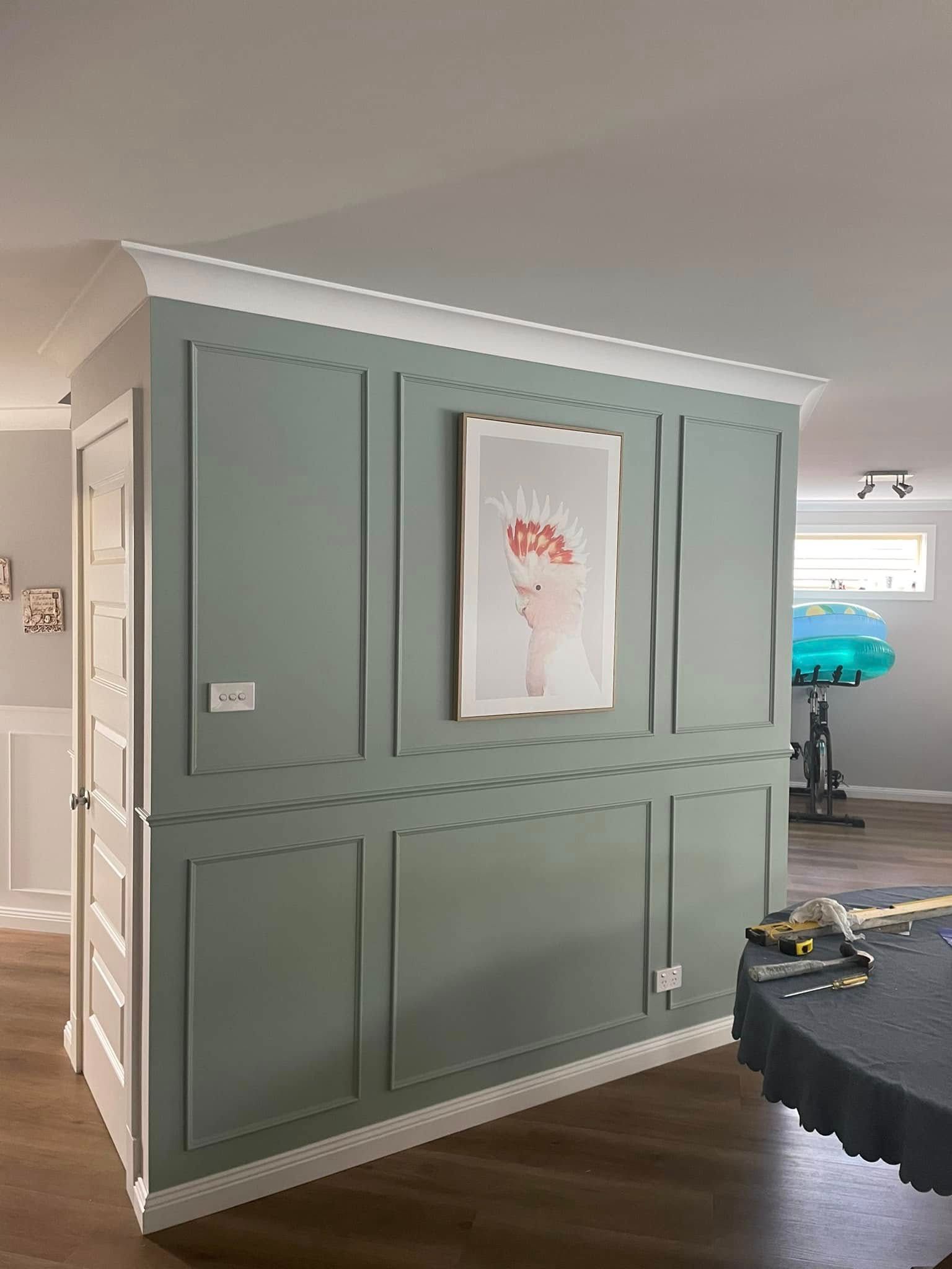 A Green Wall With A Picture Of A Cockatoo— Karl Witt Painter & Decorator In Albion Park, NSW