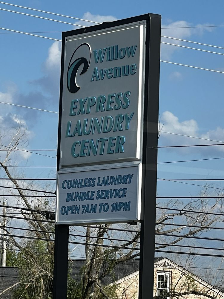 A sign for willow avenue express laundry center