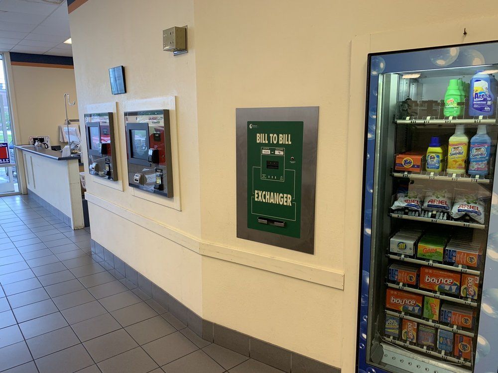 A room with a vending machine that says milk bill exchanger