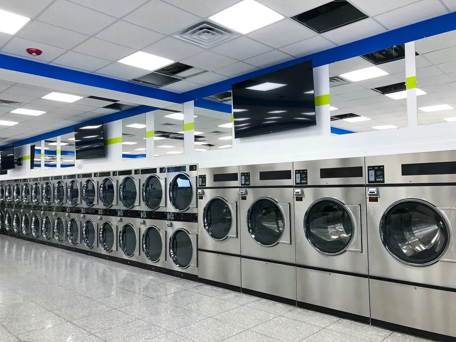 The willow avenue express laundry center is lit up at night