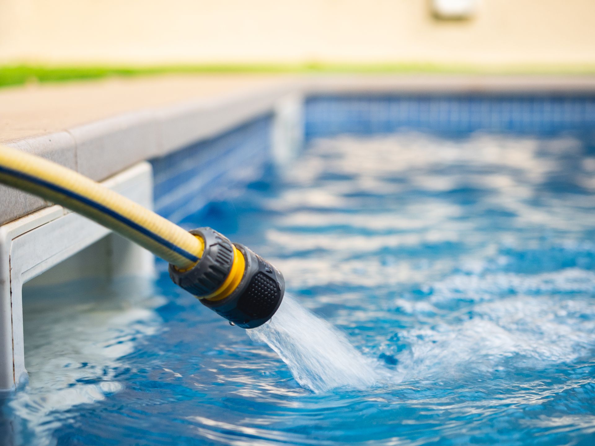 Residential swimming pool with low water level caused by overnight water loss