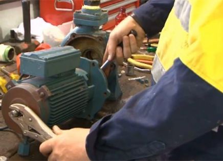technican repairing pumps