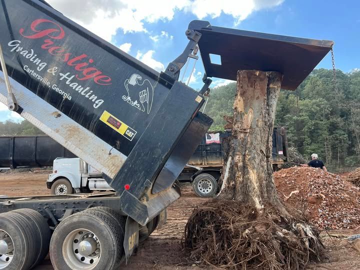 A dump truck with the word prestige on it