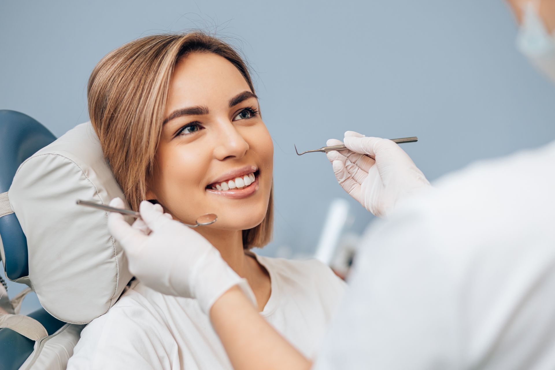 Girl receiving fluoride treatment