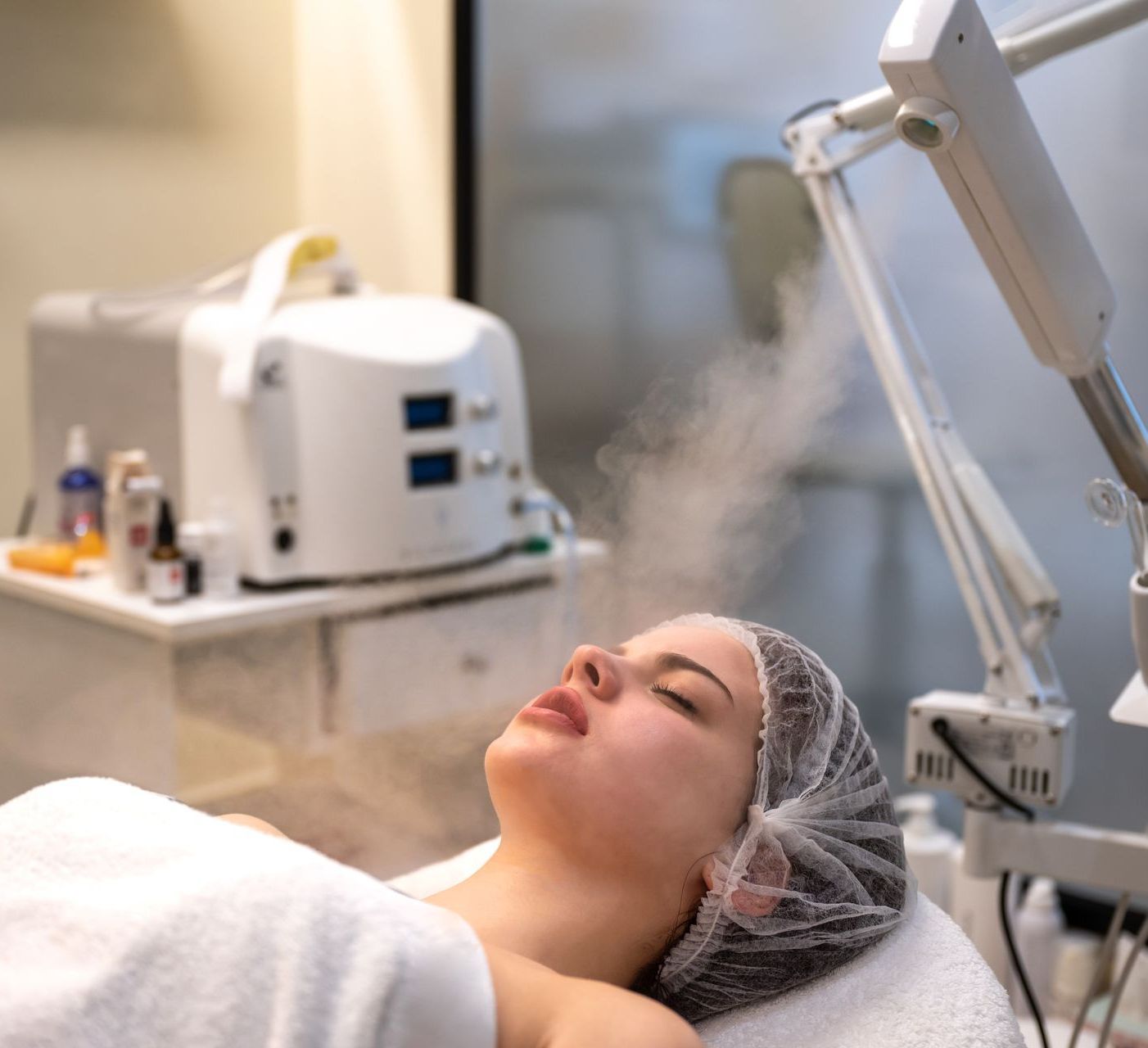Experience the benefits of ozone therapy with a trusted biological dentist in Boise, ID A woman is laying on a bed with a hair net on her head