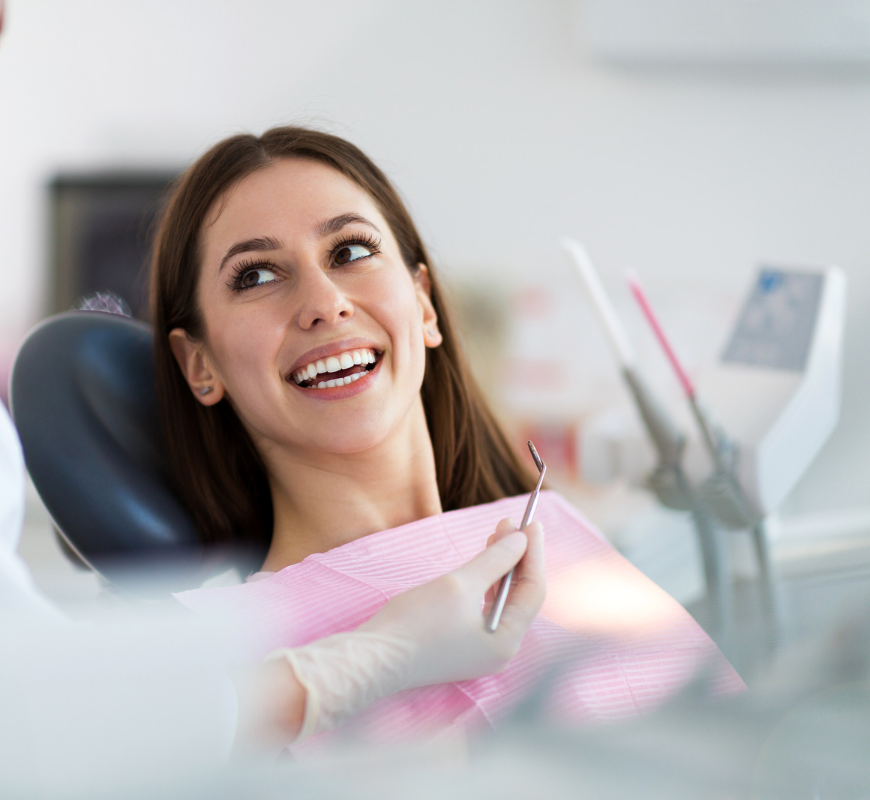 PRF therapy in Boise, ID A woman is smiling while sitting in a dental chair