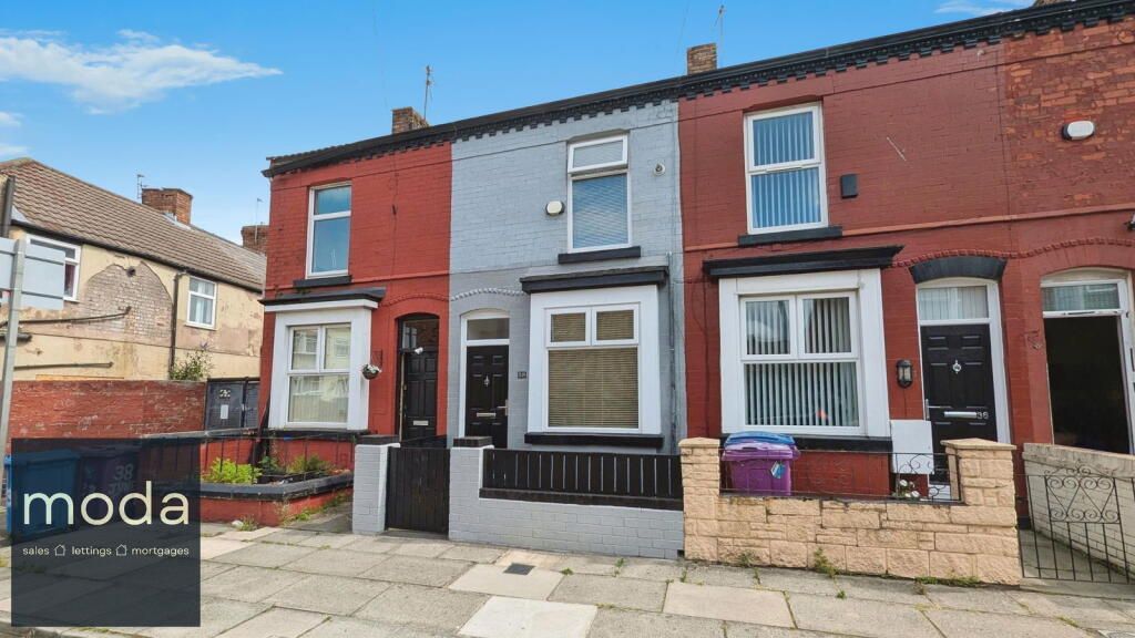 Row of terraced houses, red, grey, and brown, with black doors.