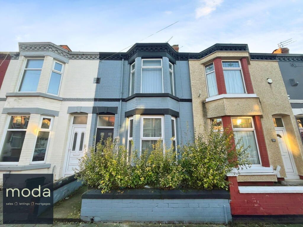 Row of colorful terraced houses with blue, gray, white, and yellow facades.