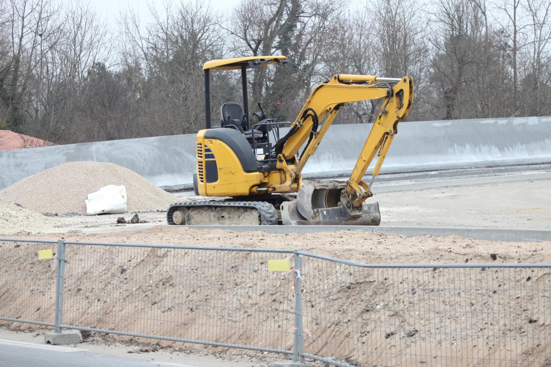 excavator above the sand